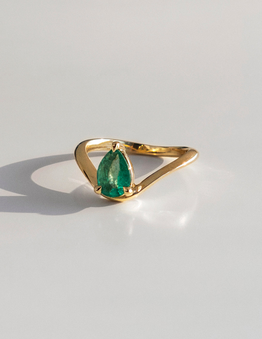 Cadette Pear emerald Sunrise engagement ring. Pear emerald nature inspired engagement ring. Pear emerald sunrise inspired engagement ring.