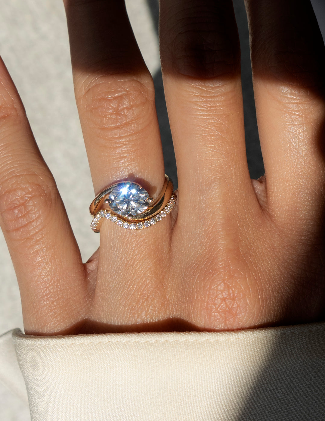Cadette Oval Rapture engagement ring with Minimal Pave Band. 