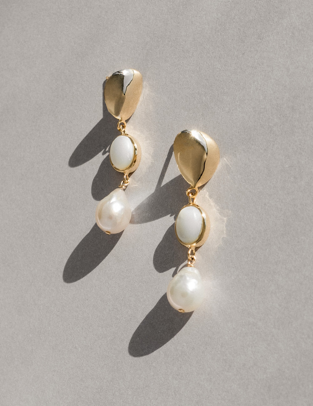 modern and unique gold baroque pearl earrings