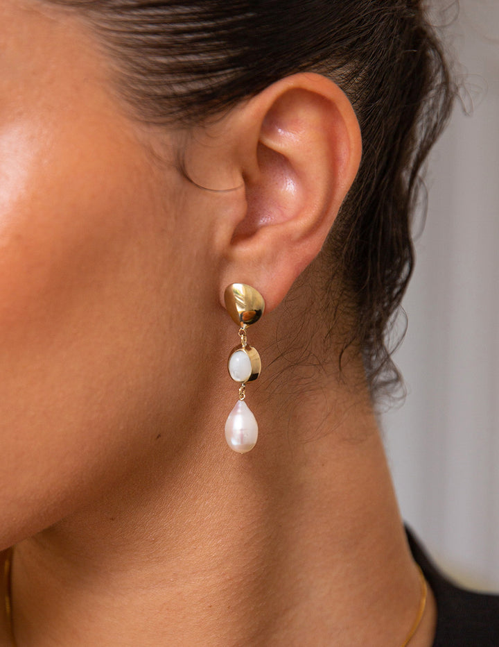 modern and unique gold baroque pearl earrings
